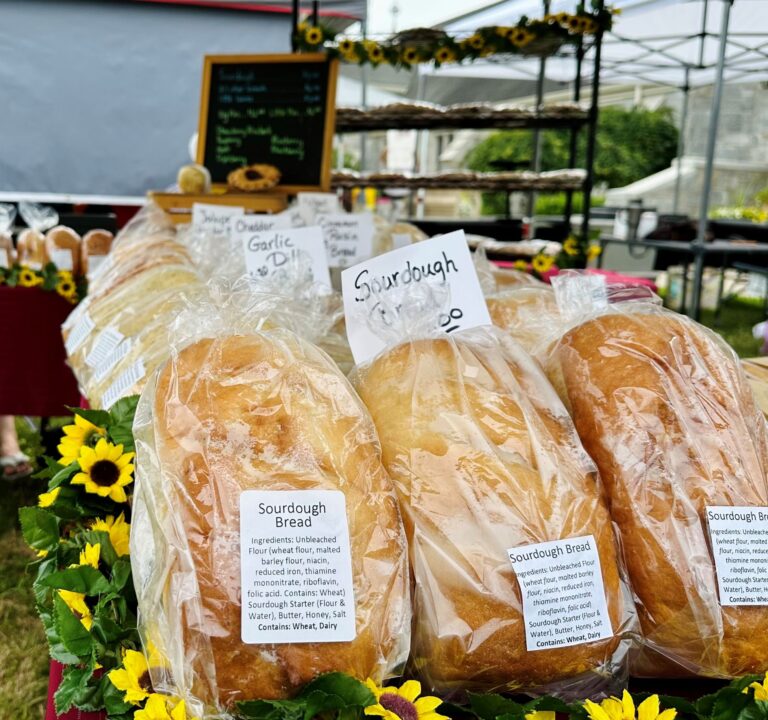 table covered in loaves of bread