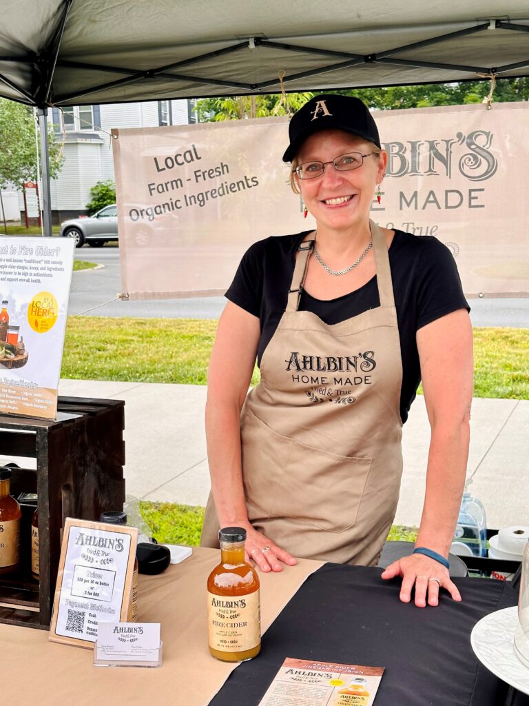 Woman in Ahlbin's Home Made apron smiling