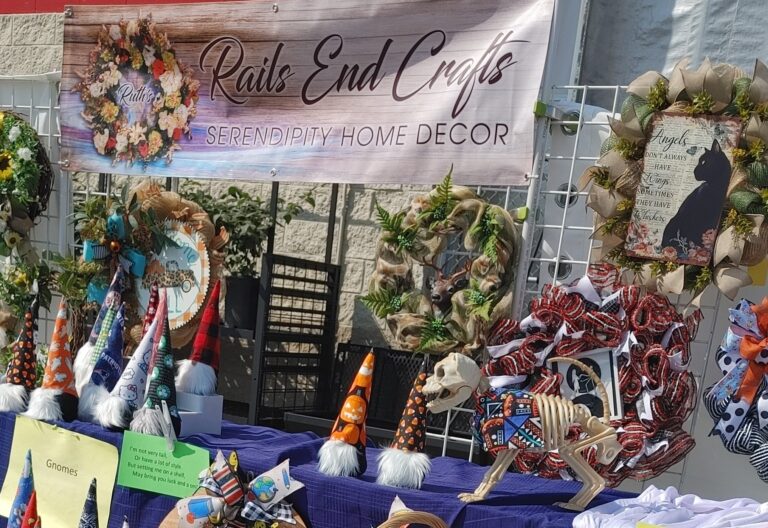 Table displaying assorted handmade craft items